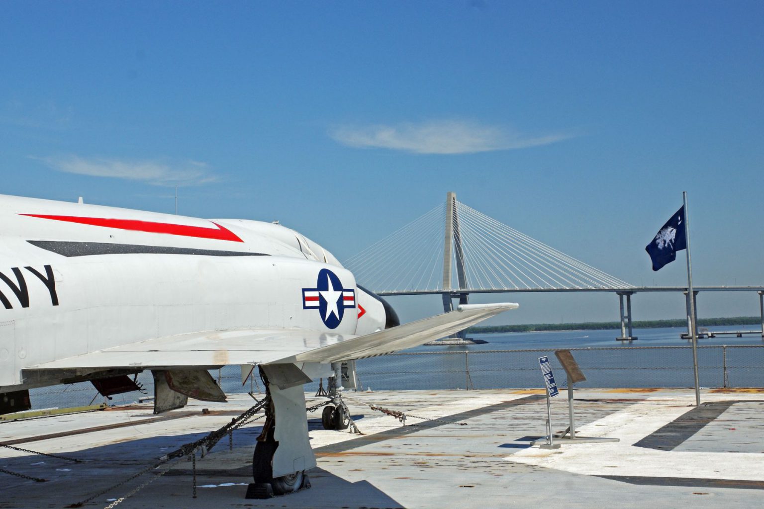 View Of A Plane On Charlestons Aircraft Carrier With A View Of The Palmetto Flag And Ravenel Bridge 1536x1024 